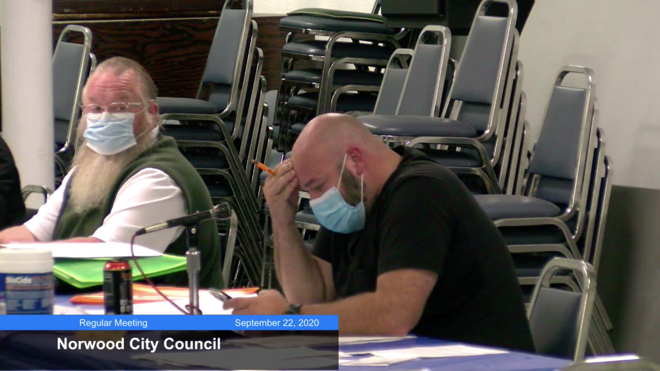 Photo of Norwood City Councilmember Matt Geraci, who is reading a letter from a resident
